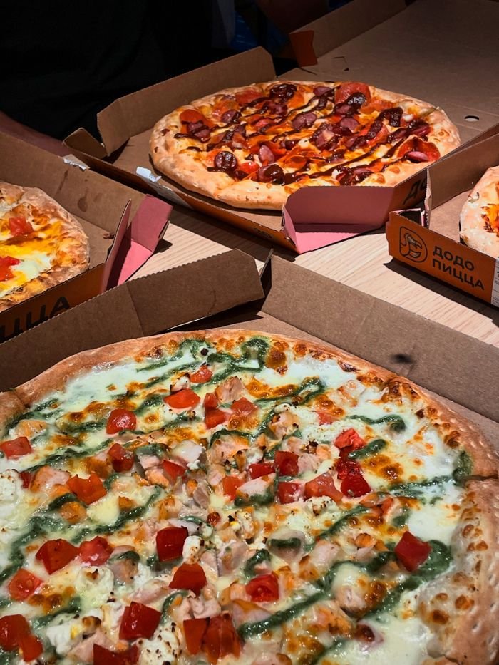 A variety of delicious pizzas with diverse toppings, perfect for sharing a meal.